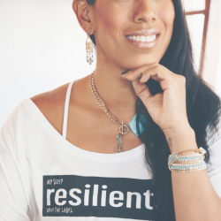 A smiling woman wears a t-shirt that reads "resilient." Pink words say "Why you don't need to fear failure" over the top of the picture.